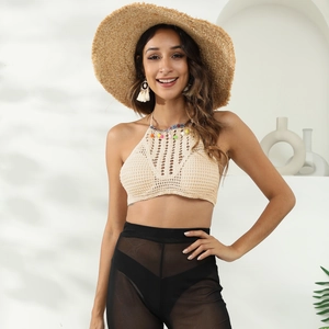 Bohemian crochet halter top in beige with ethnic trim and colorful pom-poms for beachwear