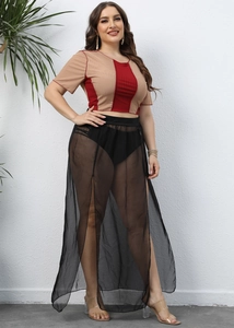 Women's plus size two-piece set featuring mesh slit maxi skirt and cropped tee