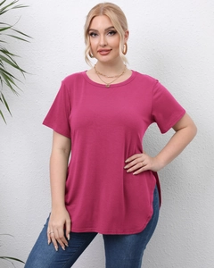 Detail view of fuchsia plus size t-shirt showing side split and curved hem design