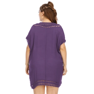 Detail view of the deep purple crochet hollow out back design on this loose beach dress