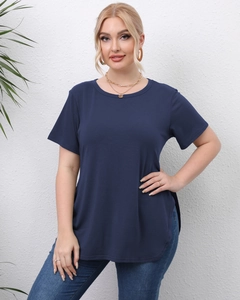 Detail of navy blue t-shirt with curved hem and side slit design on a female model
