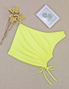 Detail view of neon green one-shoulder crop top with adjustable side drawstring texture