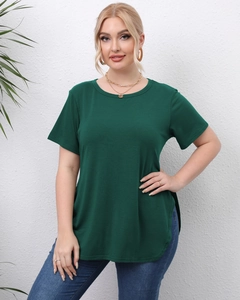 Detail of the side slit and curved hem on this loose dark green short sleeve T-shirt