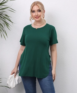 Detail of dark green plus size T-shirt with side slits and curved hem on model