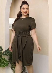 Detail view of olive green dress featuring waist tie and irregular hemline cut