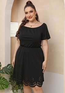 Detail of laser-cut floral pattern on the hem of a black off-shoulder plus size dress