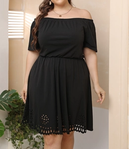 Detailed laser-cut hollow pattern on the hem of a black plus size off-shoulder dress