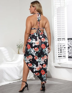 Detail of plus size two-piece floral set showing the backless halter top and tiered skirt