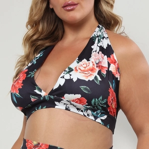 Detail of plus-size floral halter swim top with red rose print and deep V-neckline