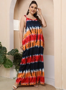 Detail of plus size maxi dress with vibrant orange and navy tie-dye stripe patterns