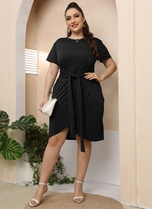 Plus size black short sleeve wrap dress with waist tie and asymmetrical hemline