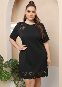 Detail of plus size black A-line dress featuring butterfly laser cut-out patterns