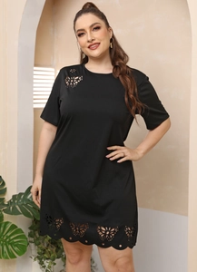 Detail of laser-cut butterfly patterns on the black plus size A-line dress with short sleeves