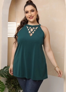 Detail of dark green halter top with unique geometric cutout lace design at the neckline