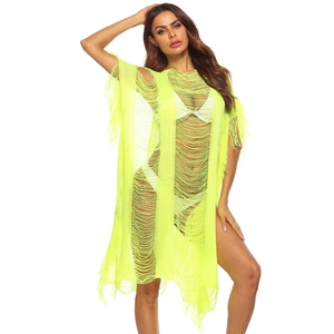 Close-up of neon green crochet beach cover-up with hollow knit and fringe details