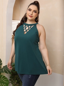 Close-up of deep green plus size halter top featuring intricate diamond cutout details