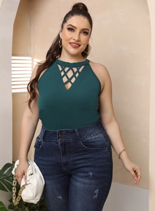 Detail of dark green halter top with criss-cross hollow mesh design and gold accessories