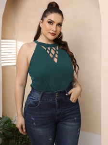 Close-up of halter neck top with criss-cross hollow mesh and denim button detail