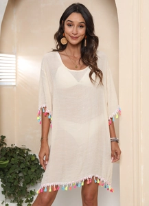 Bohemian off-white beach cover-up dress with colorful tassel trim and loose fit style