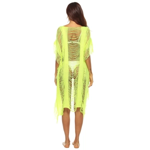 Back view of neon yellow hollow knit beach cover-up with delicate fringe tassels