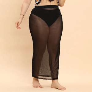 Detailed view of sheer black mesh maxi skirt fabric with high waisted elastic band