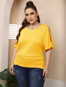 Bright yellow plus size top with off-shoulder cutouts and side ruching detail