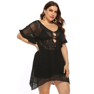 Plus size black crochet beach dress with deep V-neck, flared sleeves and mesh hollow design
