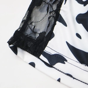 Short grande taille imprimé vache avec dentelle florale noire et tissu élastique