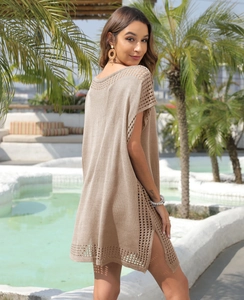 Detail of light brown knit cover-up with hollow crochet edges and side slit design
