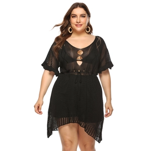 Close-up of black crochet knit beach dress featuring V-neckline and drawstring waist detail