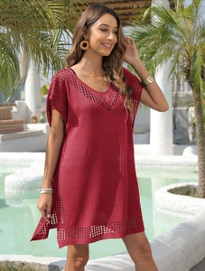 Detail of burgundy V-neck crochet cover-up with intricate hollow mesh knit patterns