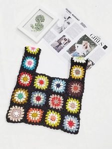 Detailed close-up of handmade crochet tote bag featuring vibrant floral granny squares