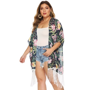 Detail of tropical floral print on chiffon cardigan with long white fringe hem decoration