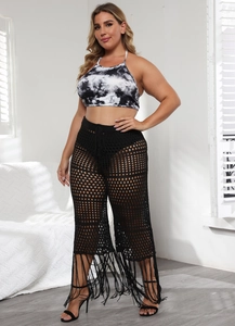 Women's boho tie-dye halter top and black crochet pants set with long fringe details