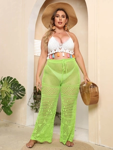Boho crochet halter top with colorful tassels and lime green wide-leg beach trousers