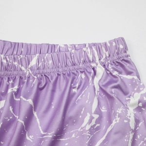 Women's beach shorts with purple marble print and elastic waistband detail view
