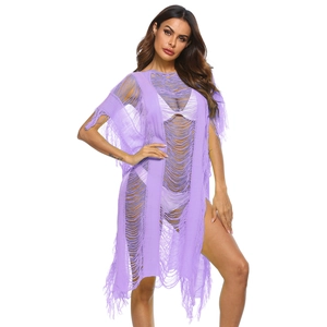 Close-up of lavender knit beach cover-up with hollow-out texture and tassel fringe hem