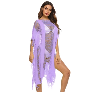 Detail of light purple knitted beach cover-up featuring hollow-out mesh and long fringe trim