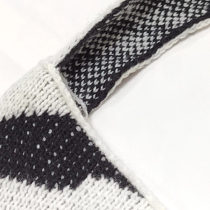 Macro shot of high-density woven shoulder strap with black and white wavy patterns