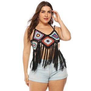 Detail of bohemian crochet granny square top featuring long black fringe and vibrant colors