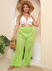 Detail of lime green high waisted crochet pants with hollow out mesh and waist drawstring