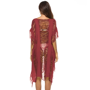 Back view of burgundy crochet beach cover-up with hollow knit pattern and long tassels