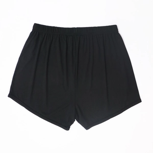 Detail view of black ribbed knit fabric and elastic waistband on casual lounge shorts