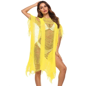 Detail of yellow hollow knit texture and long fringe tassels on beach cover-up