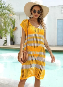 Detail of bohemian yellow striped crochet knit dress with a V-neck and hollow out pattern
