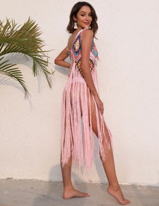 Detail of colorful crochet beach cover-up with long tassels and bohemian knit pattern