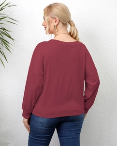 Detail view showing the loose fit and soft wine red fabric on the back of the long sleeve tee