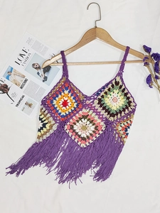 Detail of colorful crochet granny square camisole with long purple fringe trim