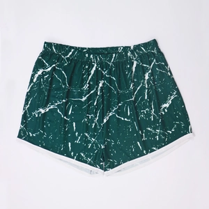 Detailed view of women's beach shorts featuring marble print and elastic waistband