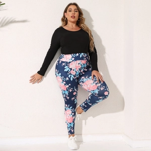 Detail of ribbed texture long sleeve top and floral high waist leggings on model